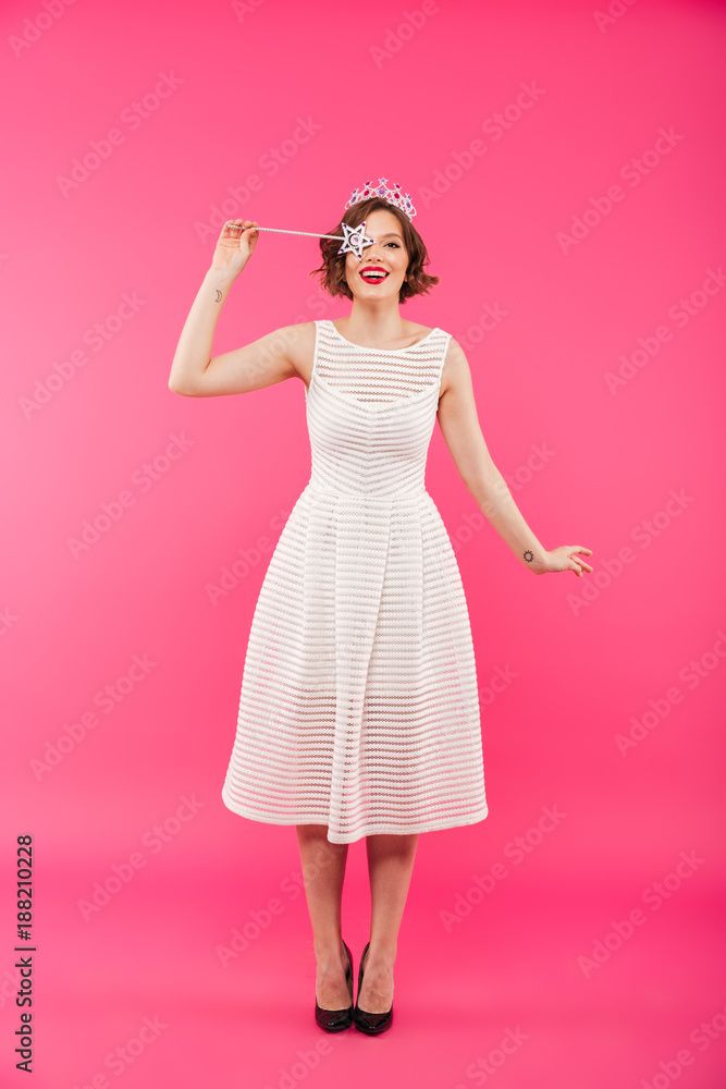 Full length portrait of a happy girl wearing crown Full length portrait of a happy girl wearing crown