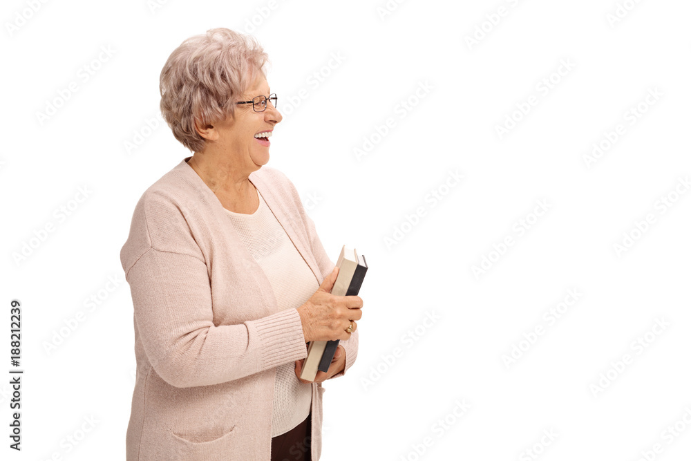Mature woman with a book smiling Mature woman with a book smiling