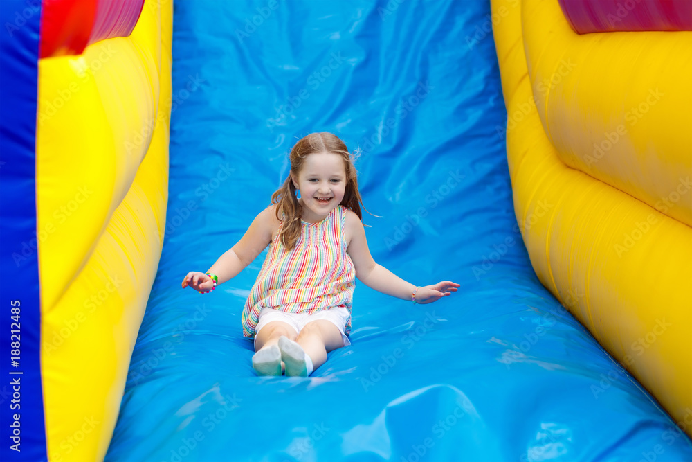 Child jumping on playground trampoline. Kids jump. Child jumping on playground trampoline. Kids jump.