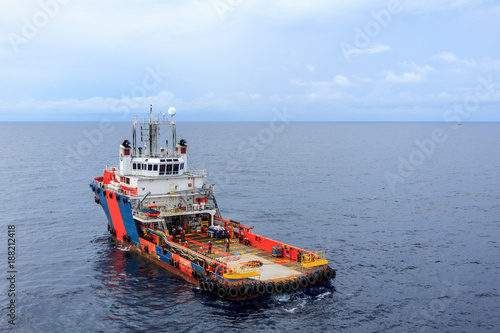 GULF OF THAILAND,SEPTEMBER 30,2017: Offshore oil and gas supply boat approach to the platform for transfer passenger between supply boat and platform.