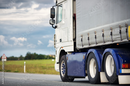 asphalt road with a truck. lorry moving