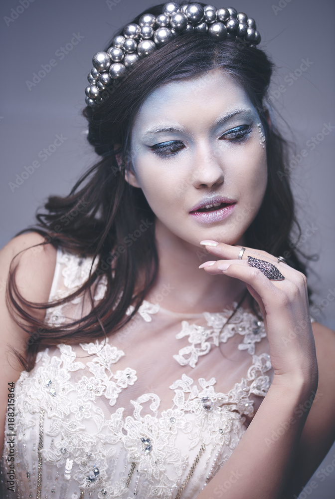 Beautiful snow maiden posing at studio shot