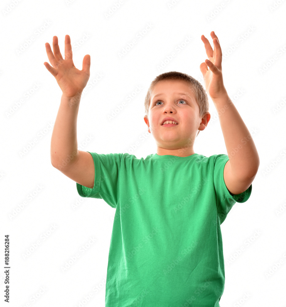 Isolated boy. A young man in a green T-shirt. The boy is catching his hands. Isolated boy. A young man in a green T-shirt. The boy is catching his hands.