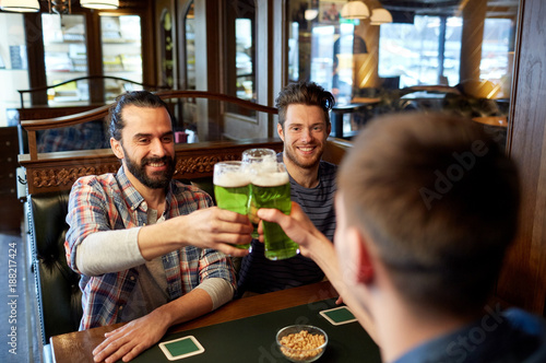 Принти на полотні male friends drinking green beer at bar or pub