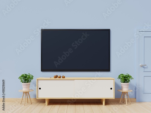 Tv in modern empty room have back blue wall background, 3d rendering
