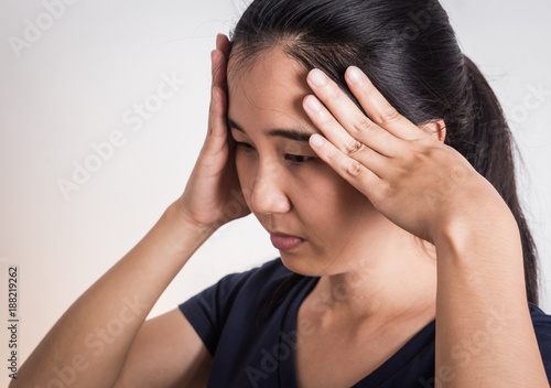 Young woman with hard headache