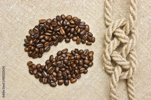 coffee beans and rope knot on sack photo