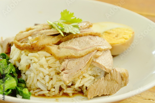 boiled duck meat slice dressing brown sauce with pickled cabbage on rice