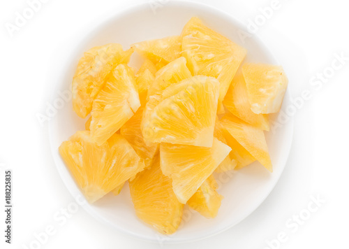 Pineapple on white plate isolated