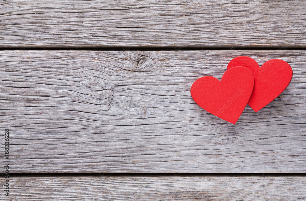 Valentine background with handmade hearts on rustic wood Valentine background with handmade hearts on rustic wood