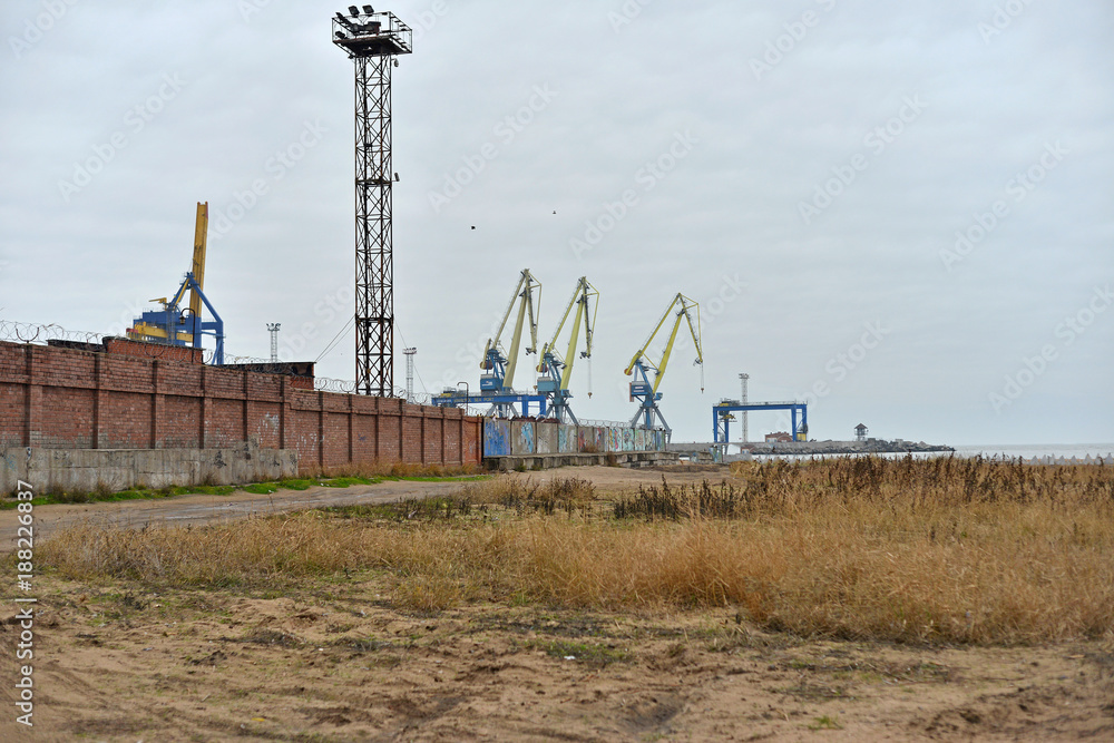 Торговый порт, Shipping.cargo to harbor.Aerial view.Top view.. Cargo cranes in the dock by the water over blue sky