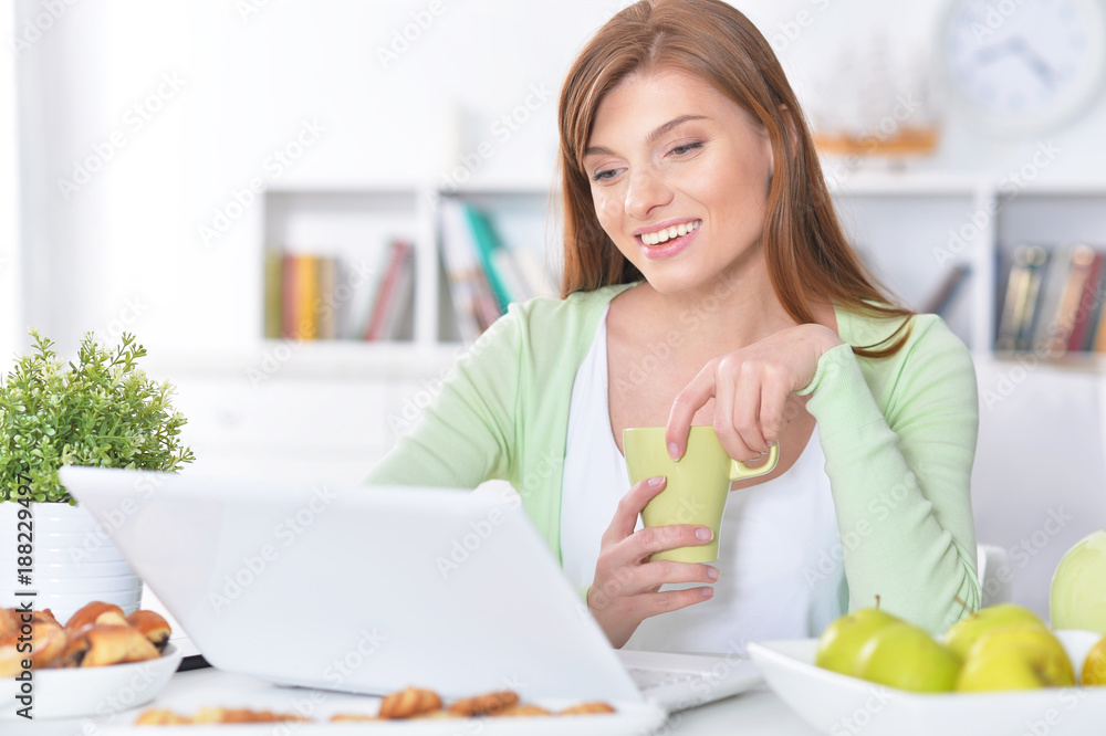 young woman using laptop