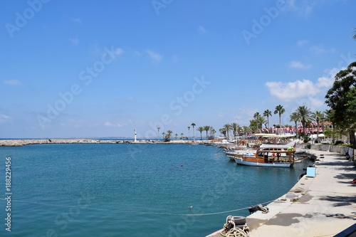The coast of the Mediterranean sea with yachts and tourist center.