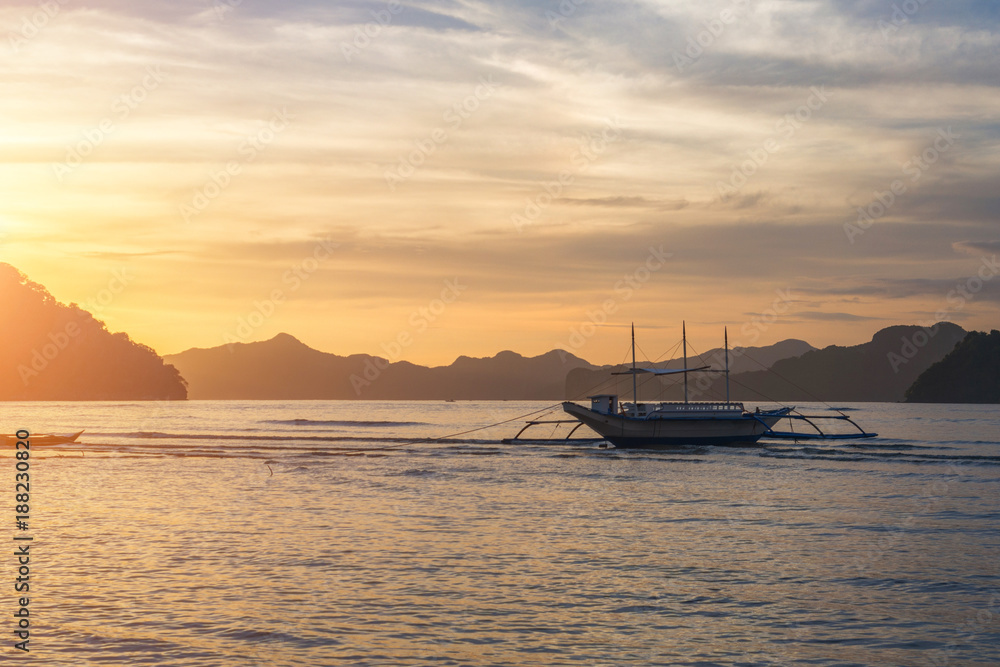 Bangka boat view at beautiful sunset on El Nido bay, Palawan island, Philippines