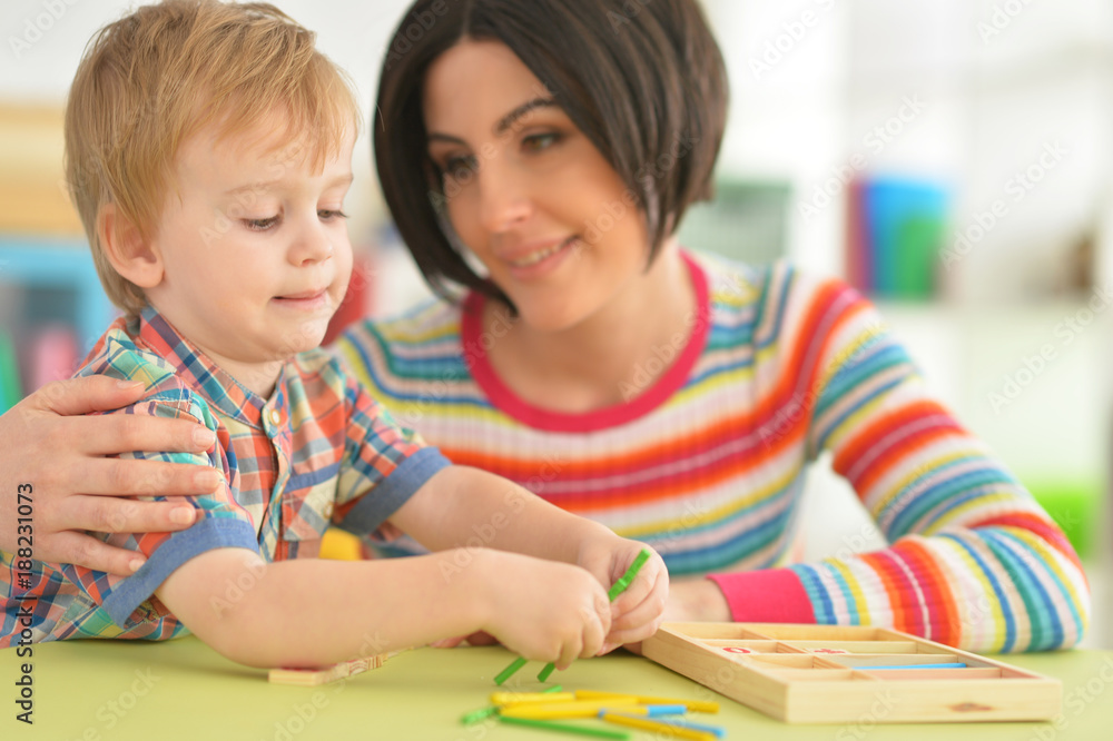 Young mother playing with son Young mother playing with son