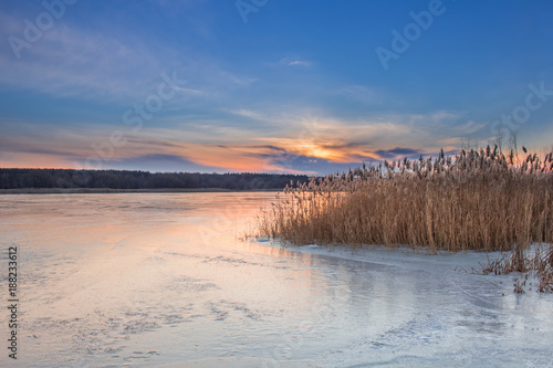 Winter paysage landscape of sunset evening iced lake