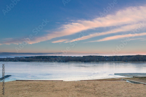 Winter paysage landscape of evening iced frozen lake beach photo