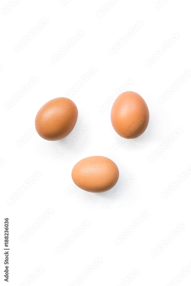 fresh brown organic chicken eggs isolated on white background. Vertical composition. Top view