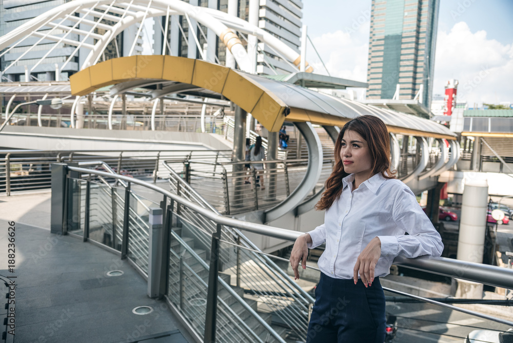 Portraits of beautiful asian woman look cheerful and confidence is standing in outdoors while feeling success with work. Portraits of beautiful asian woman look cheerful and confidence is standing in outdoors while feeling success with work.