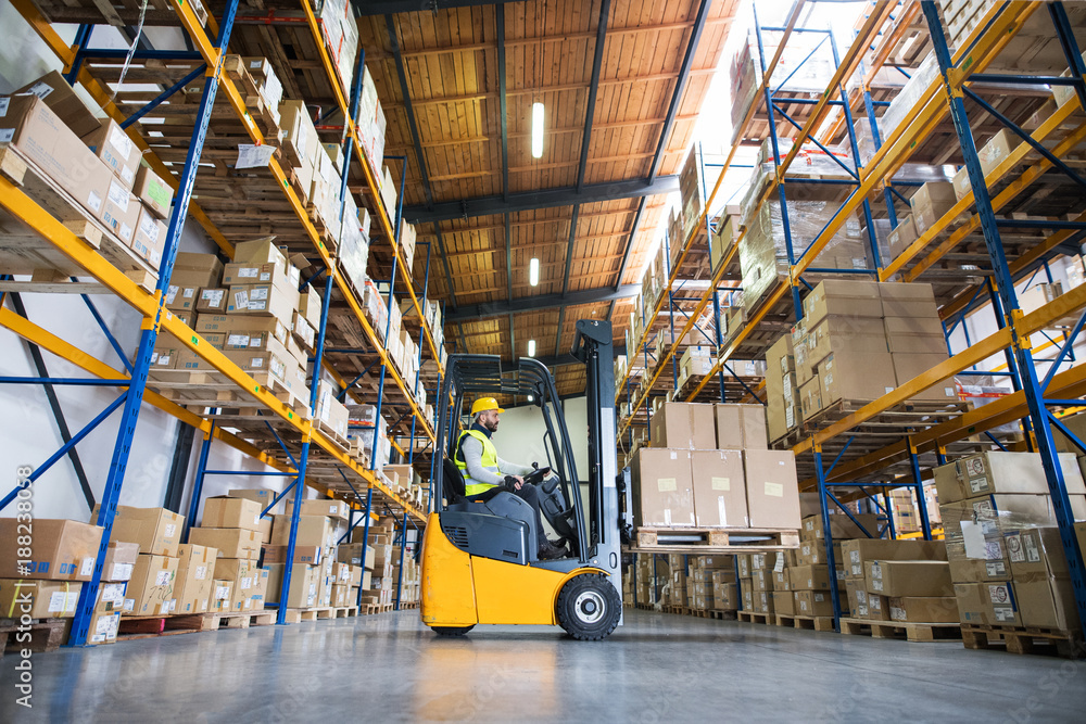 Warehouse man worker with forklift. - obrazy, fototapety, plakaty 