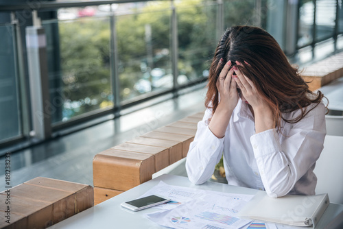 Portraits of beautiful asian woman stressed from work.