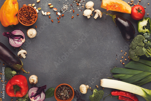 Frame of fresh vegetables on wooden background with copy space