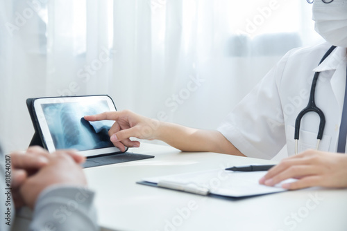 Wallpaper Mural Asian Female Doctor discussing with senior man patient. Torontodigital.ca