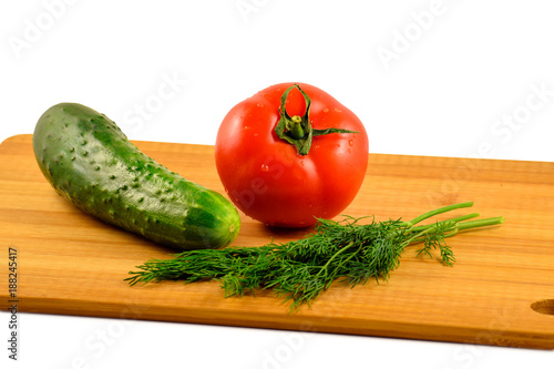 Tomato, cucumber and dill on a white background.