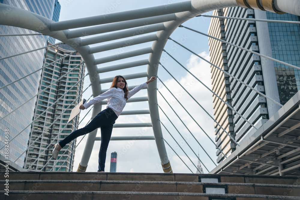 Portraits of beautiful asian woman look confidence is standing and holding document folder. concept of setting business goals. Portraits of beautiful asian woman look confidence is standing and holding document folder. concept of setting business goals.