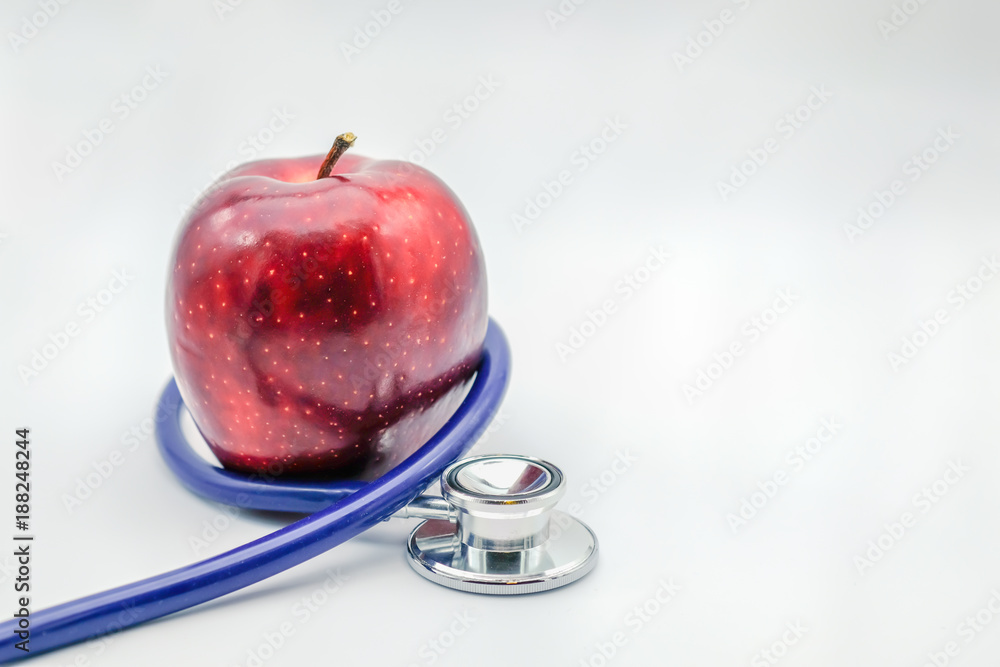Health Care Concept. Close up of Stethoscope with fresh red apple on white background. Health Care Concept. Close up of Stethoscope with fresh red apple on white background.