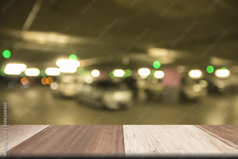 Plank wooden table on front Defocused blurred car park  background. for presentation