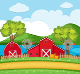 Farm scene with red barns and wind turbines