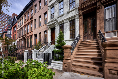 a row of colorful brownstone buildings
