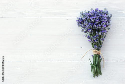 Lavender flowers on white wooden background