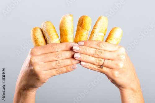 woman's hand holding cheese fingers