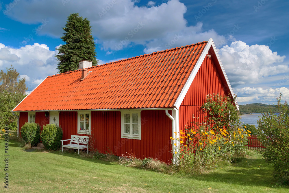 Typical red wooden house in Sweden Typical red wooden house in Sweden