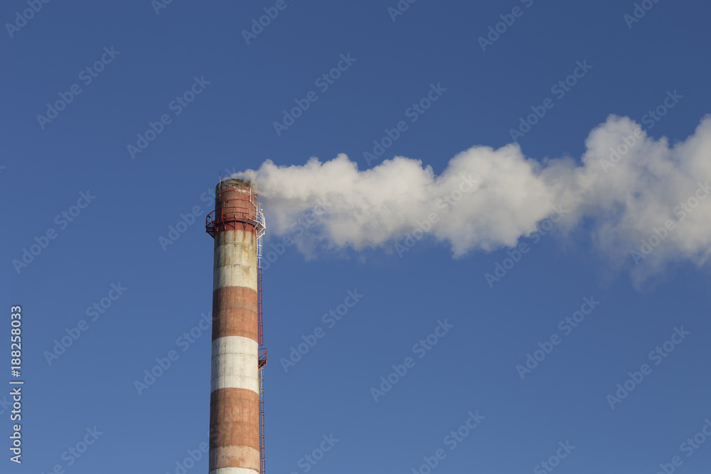 smoke tube CHP against the blue sky