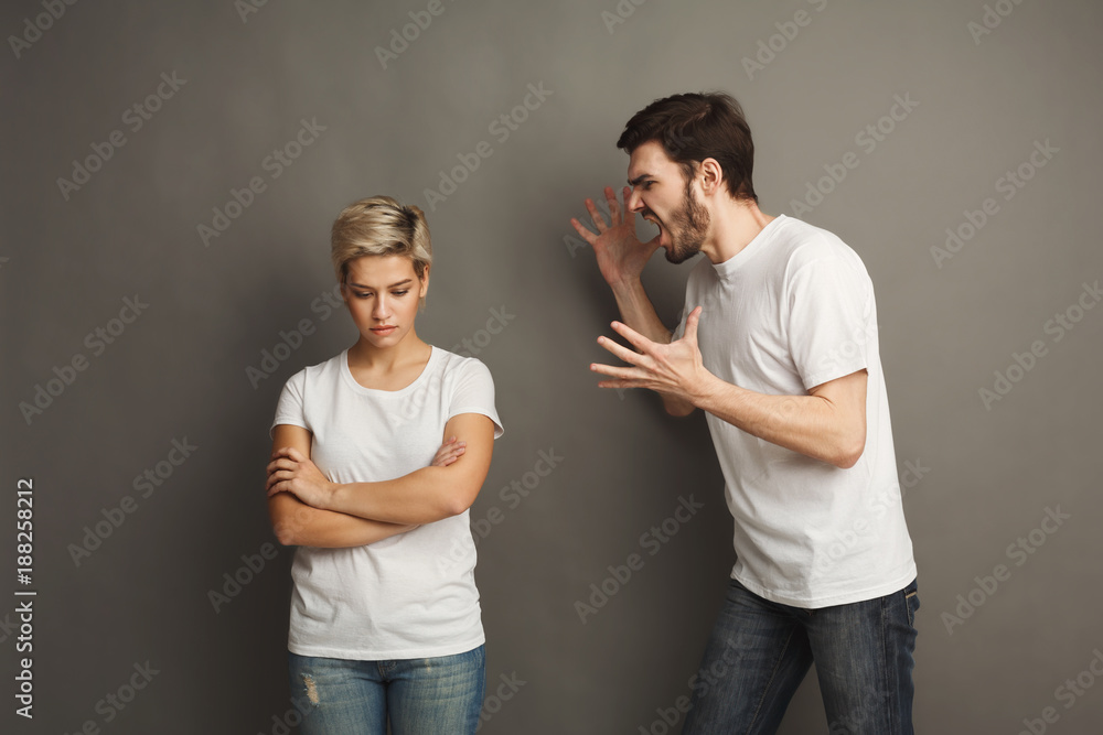 Couple in quarrel, woman shouting to boyfriend Couple in quarrel, woman shouting to boyfriend