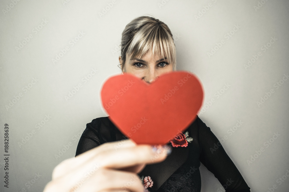 Beautiful girl holding paper heart Beautiful girl holding paper heart