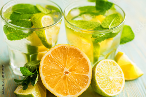 Lemonade or mojito cocktail with lemon and mint