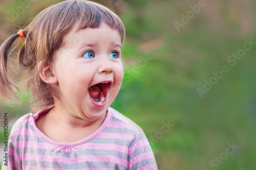 Little girl is surprised and happy