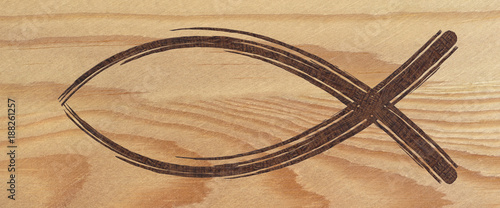 Photography Christian fish symbol web banner on wood. Religious sign