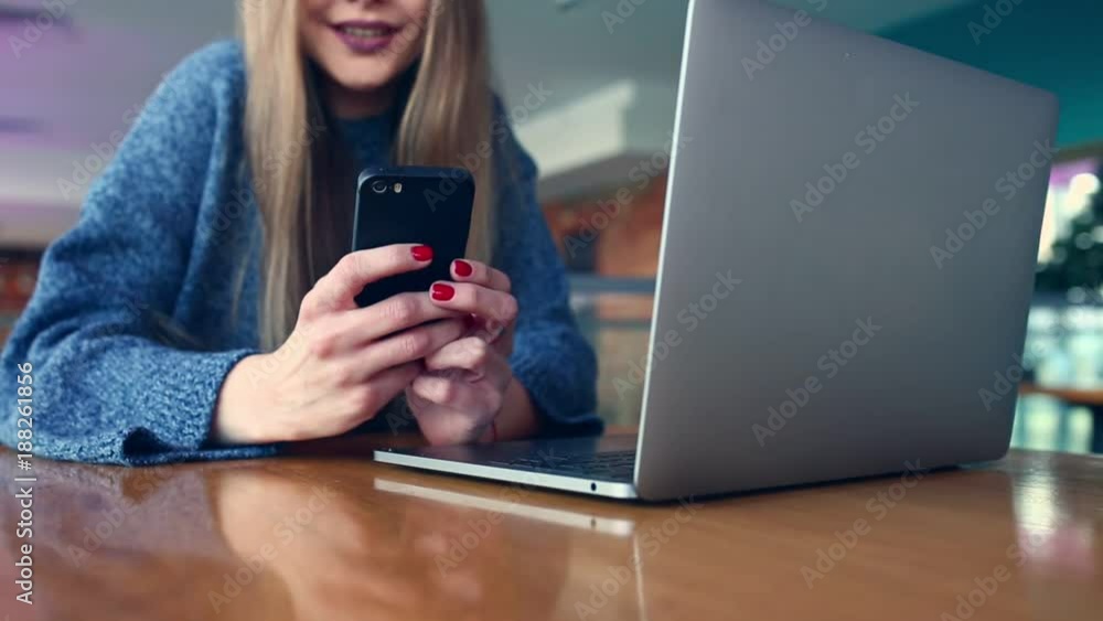 Close up of women's hands holding cell telephone with blank copy space scree for your advertising text message or promotional content, hipster girl watching video on mobile phone during coffee break Close up of women's hands holding cell telephone with blank copy space scree for your advertising text message or promotional content, hipster girl watching video on mobile phone during coffee break