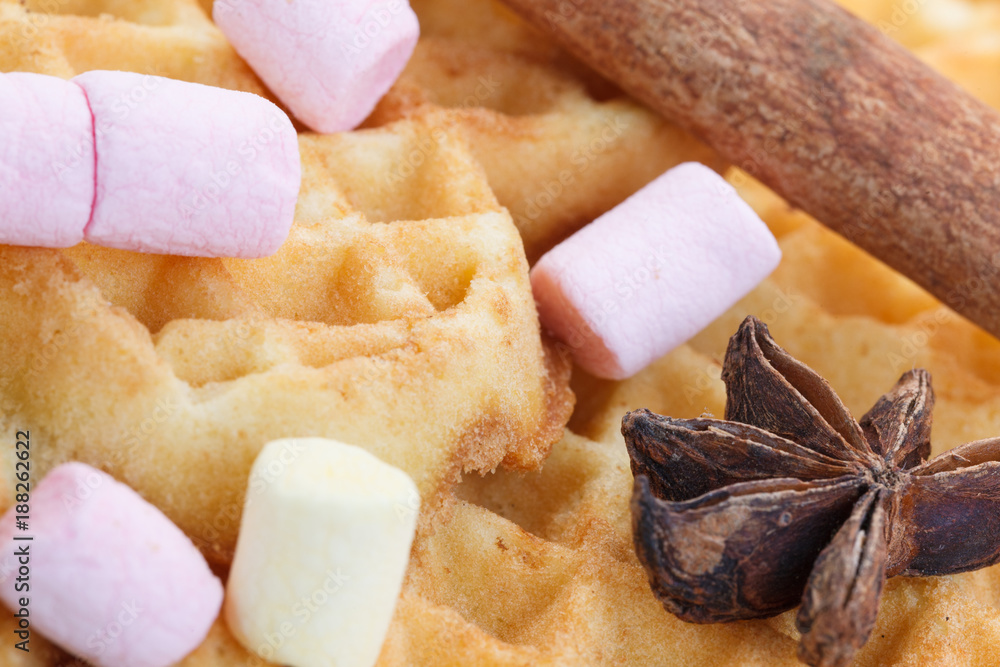 Fototapeta premium Heart shaped cookies on a wooden background, with cinnamon, anise and marshmallow.