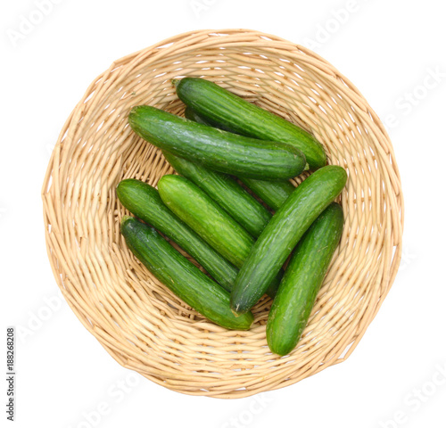 fresh cucumbers isolated in basket on white