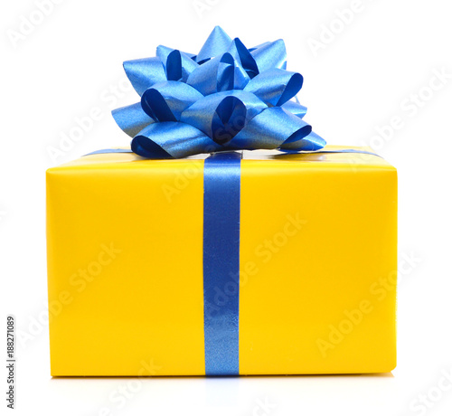 gift yellow box with blue ribbon bow close up isolated on white background photo