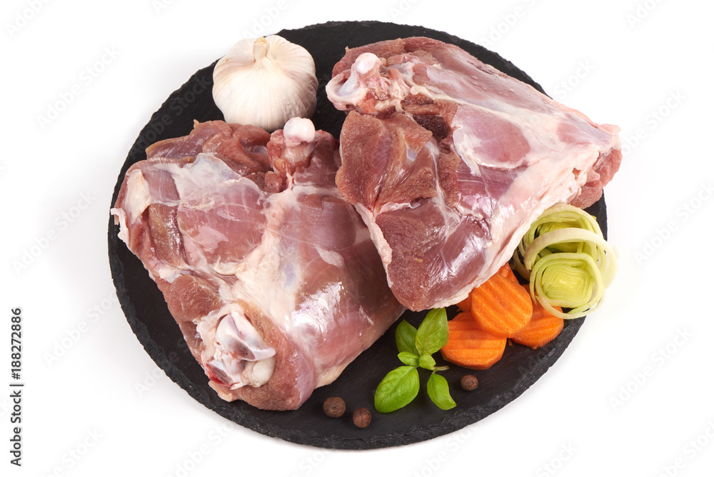 Raw turkey meat on stone plate, isolated on white background. Raw turkey meat on stone plate, isolated on white background.