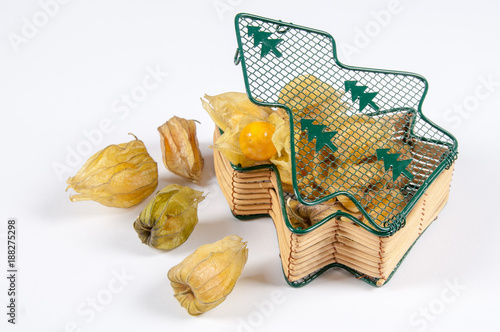 physalis fruit Physalis peruviana and some peeled ones on a white background photo