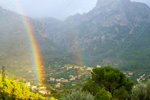 double rainbow in the mountains. Strong rainbow after rain. Fairyland.