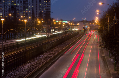 City highway with a tram line in the evening.